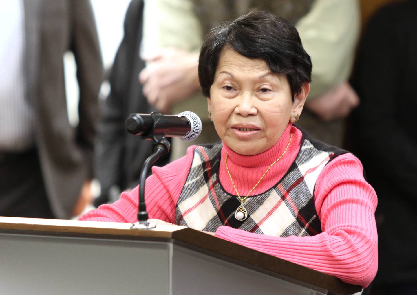 Ging Smith, wife of outgoing mayor Jerry Smith, thanks the citizens of DeKalb for their support during Mayor Smith's tenure in office the past four years Monday at the City Council meeting in the DeKalb Public Library.