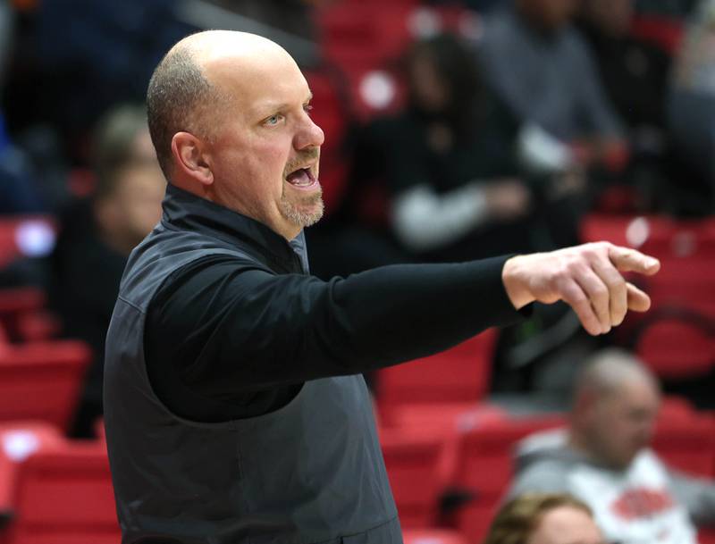 Sycamore head coach Adam Wickness talks to his team Friday, Jan. 30, 2026, during their game against DeKalb in the FNBO Challenge in the Convocation Center at Northern Illinois University in DeKalb.