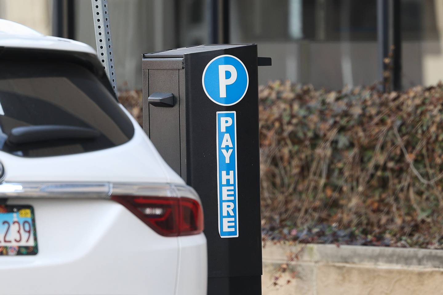 A car is parked near a parking meter in downtown Joliet on Wednesday Mar. 6th, 2024.
