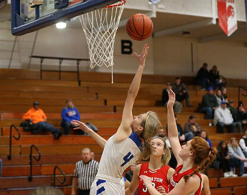 Princeton's Erin May (4) dribbles through the lane and scores on a layup over Streator defenders in the Lady Tigers Holiday Tournament on Tuesday, Nov. 15, 2022 in Princeton.