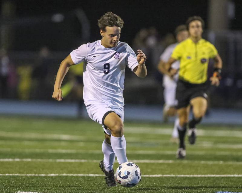 Downers Grove North's Ty Peboontom (9) races down the pitch during soccer match between Downers Grove North at Downers Grove South. Oct 2, 2025.