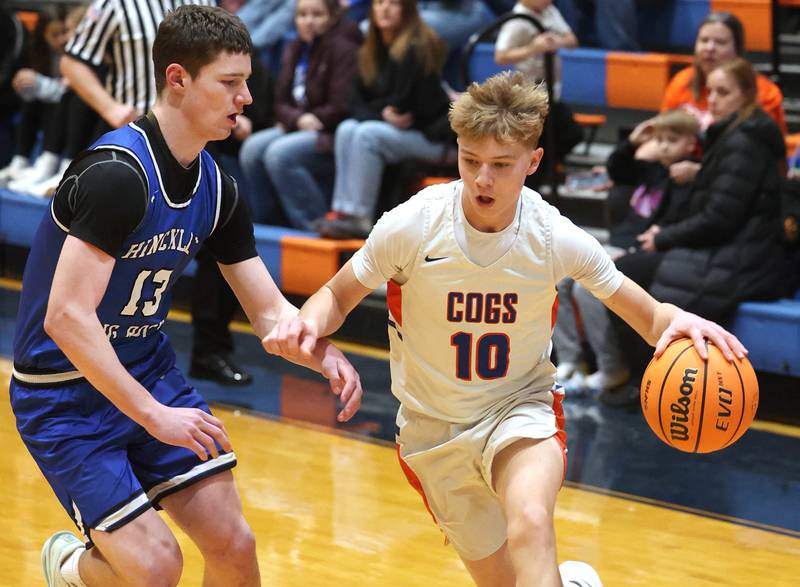 Genoa-Kingston's Trevor Rhoads tries to get around Hinckley-Big Rock's Jacob Orin Tuesday, Jan. 6, 2026, during their game at Genoa-Kingston High School.
