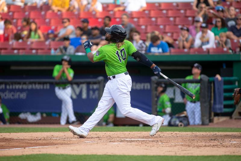 Second baseman Sherman Johnson (10) hits a home run during a game against the Lake Country Dockhounds at Northwestern Medicine Field on Tuesday, July 26, 2022.