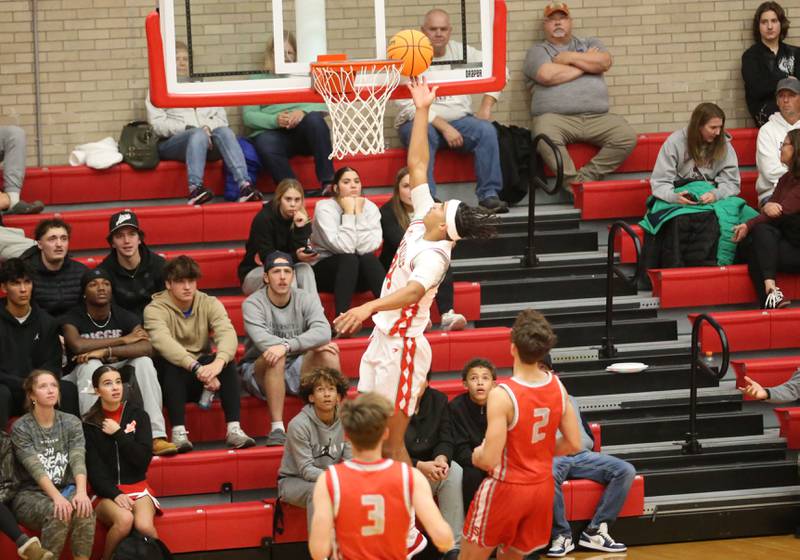 L-P's Marion Persich runs in for a layup over Streator's Matt Williamson and teammate Nolan Ketcham during the Dean Riley Shootin' The Rock Thanksgiving Tournament on Monday, Nov. 25, 2024 in Kingman Gym at Ottawa High School.