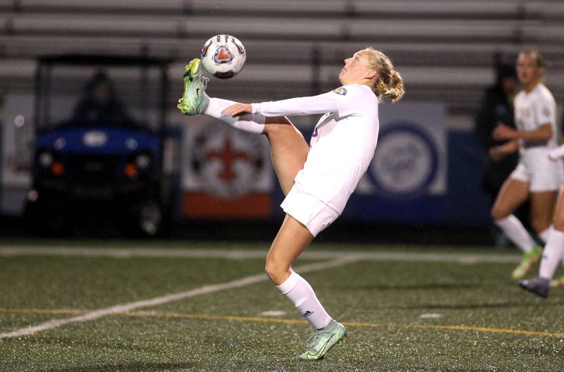 Lyons Township’s Eleanor Musgrove kicks the ball during a game at Geneva on Thursday, March 24, 2022.
