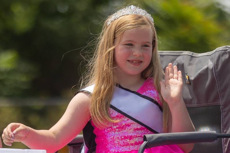Lil' Miss Amboy 2023, Addison Seloover, waves and smiles during the 60th annual Petunia Festival Parade on Sunday, July 7, 2024.