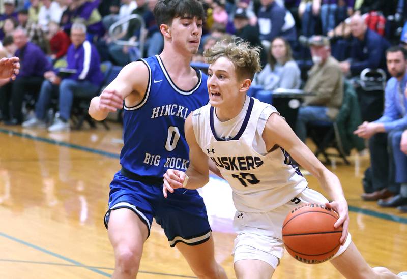 Serena's Carson Baker drives around Hinckley-Big Rock's Landon Roop Friday, Feb. 3, 2023, during the championship game of the Little 10 Conference Basketball Tournament at Somonauk High School.