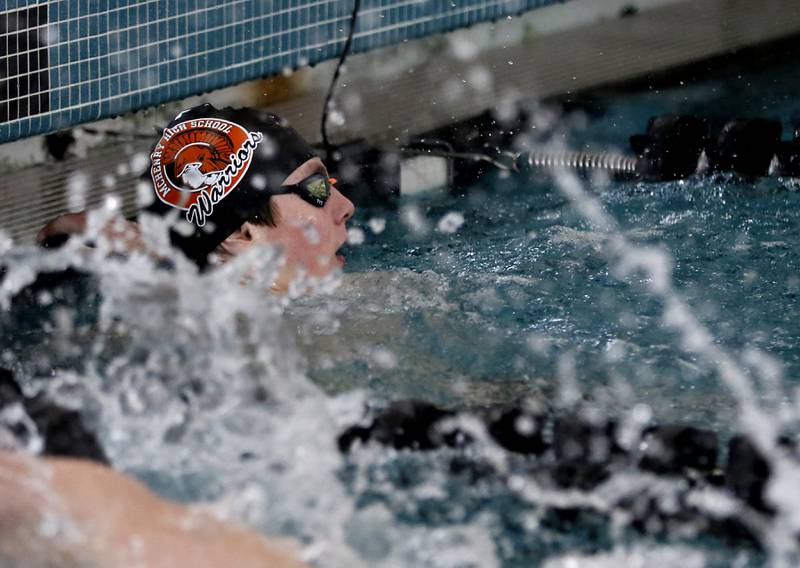 McHenry’s Robbie Rosenbaum looks at his winning time after competing in the 100 Freestyle during the Fox Valley Conference Invitational swim meet on Saturday,  Feb. 15, 2025, at Woodstock North High School.