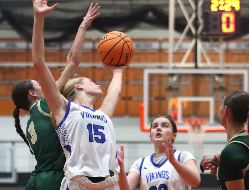 Geneva’s Emma Peterson, center, and Nora Hatton, right, look for a rebound against Boylan in girls IHSA Class 3A Sectional basketball on Tuesday, Feb. 24, 2026, at Crystal Lake Central High School in Crystal Lake.