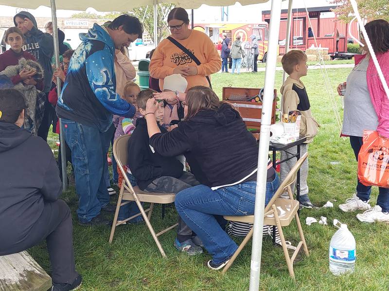 Blaize Bertalot gets their face painted Saturday, Oct. 14, 2023, during the third annual Fall Festival in Knudson Park in Marseilles.