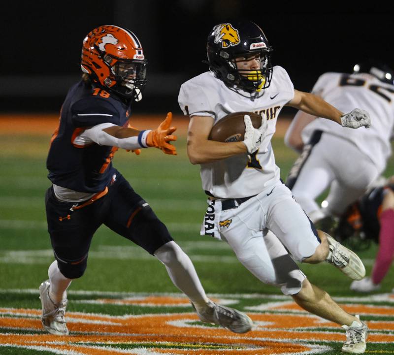 Neuqua Valley’s Sean Anshel, right, looks to get past Naperville North’s Christian Briggs during a football game played on Friday, Oct. 11, 2024 in Naperville.