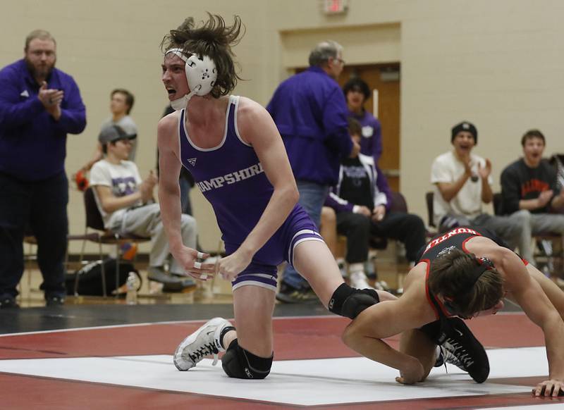 Hampshire's Logan Campbell celebrates defeating Huntley’s Matthew Keaty in the 138-pound match of a Fox Valley Conference wrestling match Wednesday, Jan. 24, 2024, at Huntley High School.