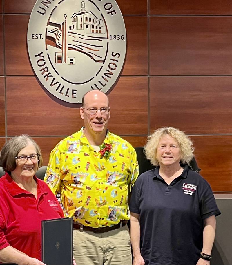 Mayor John Purcell of Yorkville proclaims May 5 – 11 as “Poppy Awareness Days” in Yorkville, with JoAnne Liebold and Dianne Dillow of the Yorkville American Legion.