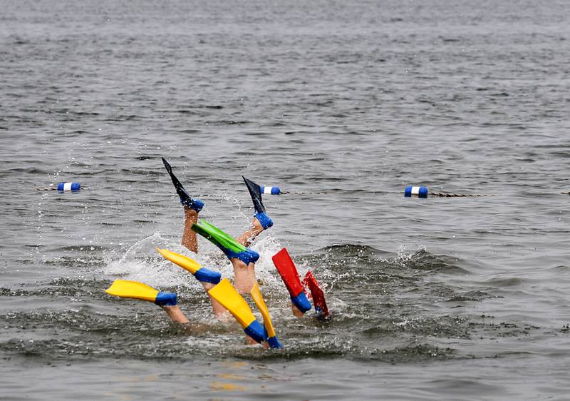 New lifeguards practice their deep water searching technique Wednesday, June 1, 2022, during a lifeguard training session at Crystal Lake's Main Beach.