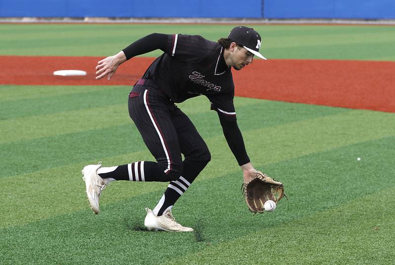 Marengo's Michael Kirchhoff fields a bunt from Johnsburg's Evan Pohl during a Kishwaukee River Conference baseball game on Monday, April 21, 2025, at Johnsburg High School.