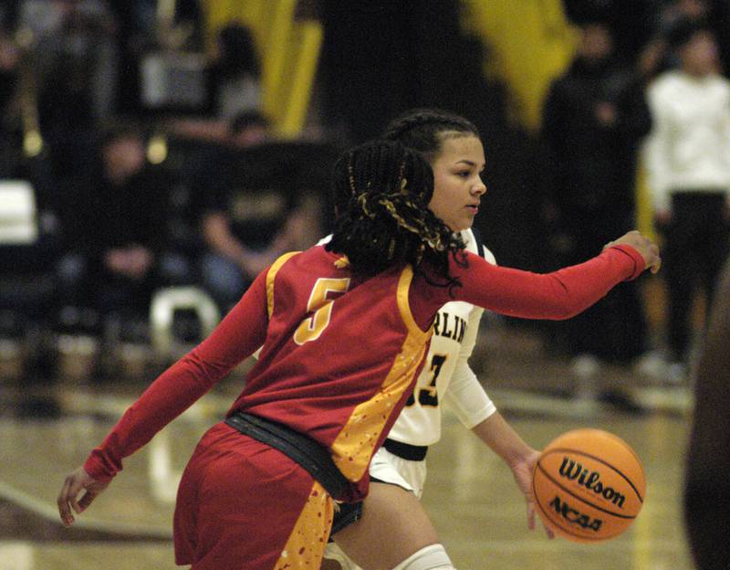 Sterling's Joslynn James drives the ball past a RockIsland defender. Western Big 6 conference champions Sterling hosted Rock Island in girls basketball. The action took place Thursday, February 13, 2025 at Musgrove Fieldhouse at SHS.