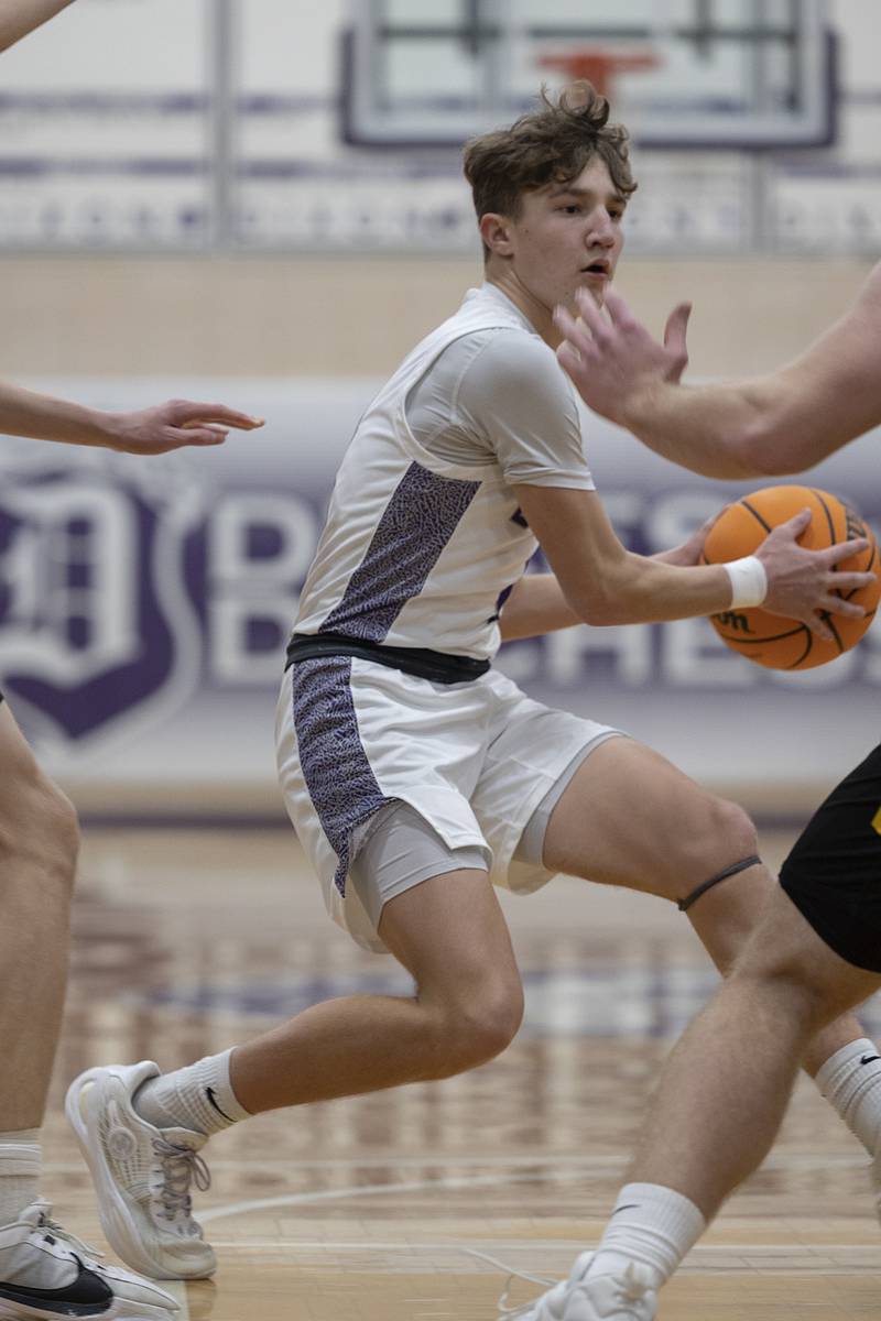 Dixon’s Brody Nicklaus handles the ball against Elk Grove Saturday, Jan. 11, 2025, at Dixon High School.