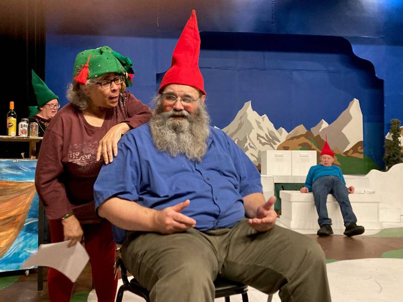 Cheryl Foster (left) chats with fellow gnome Roger McReynolds at The Drunk’n Gnome Tavern during of the live comedy show “The Drunk’n Gnome.” The tavern's proprietor Sledge (Carole Harris, back left) works in the background while veteran gnome Tom Novotny (right) lounges in a "tipsy" pose.