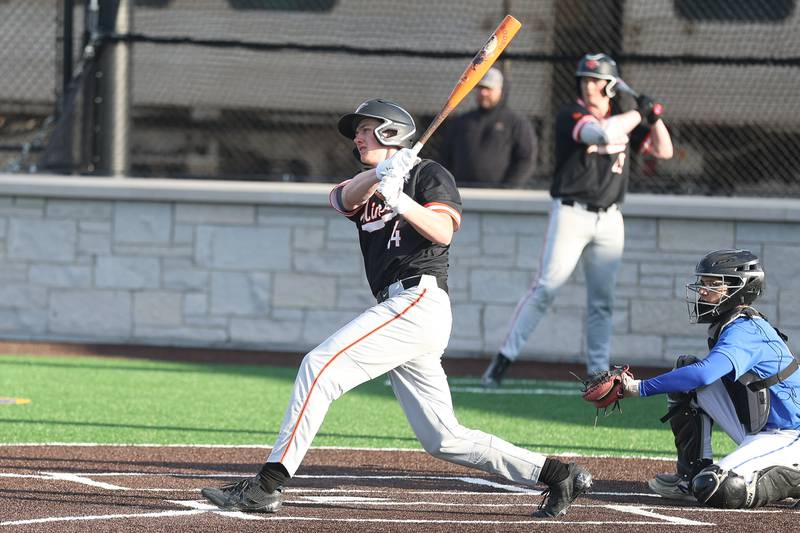 Minooka’s Kyle Rodak connects for a RBI single against Joliet Central on Monday, April 6, 2026 in Joliet.