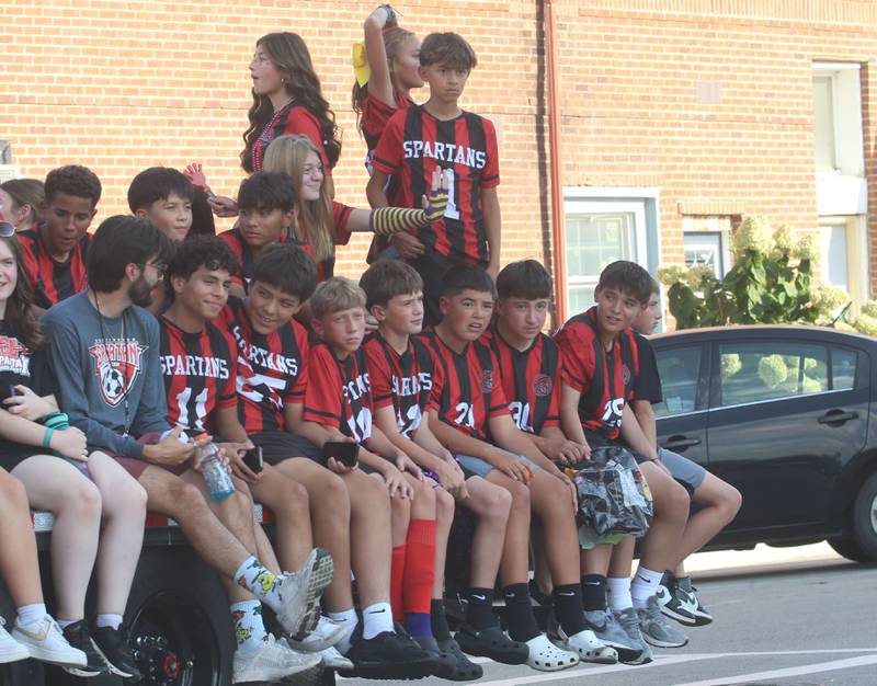 Mendota Northbrook Jr. High School students ride down Indiana Avenue during the homecoming parade on Friday, Oct. 3, 2025