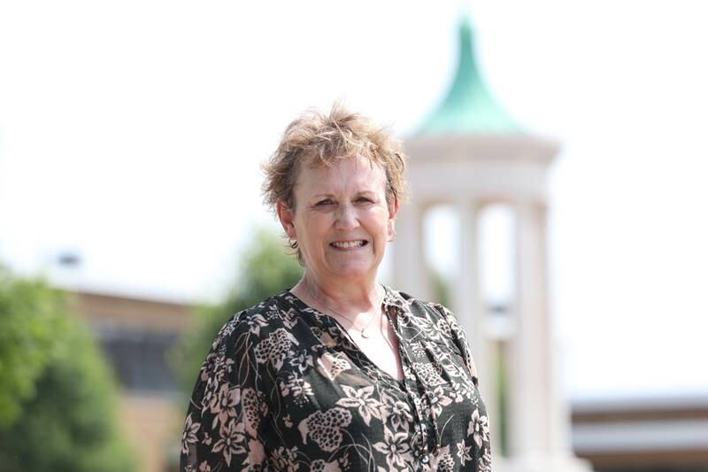 Amy Douglas, retired Joliet Catholic technology teacher, poses for a photo outside the school on Monday, June 19, 2023 in Joliet.