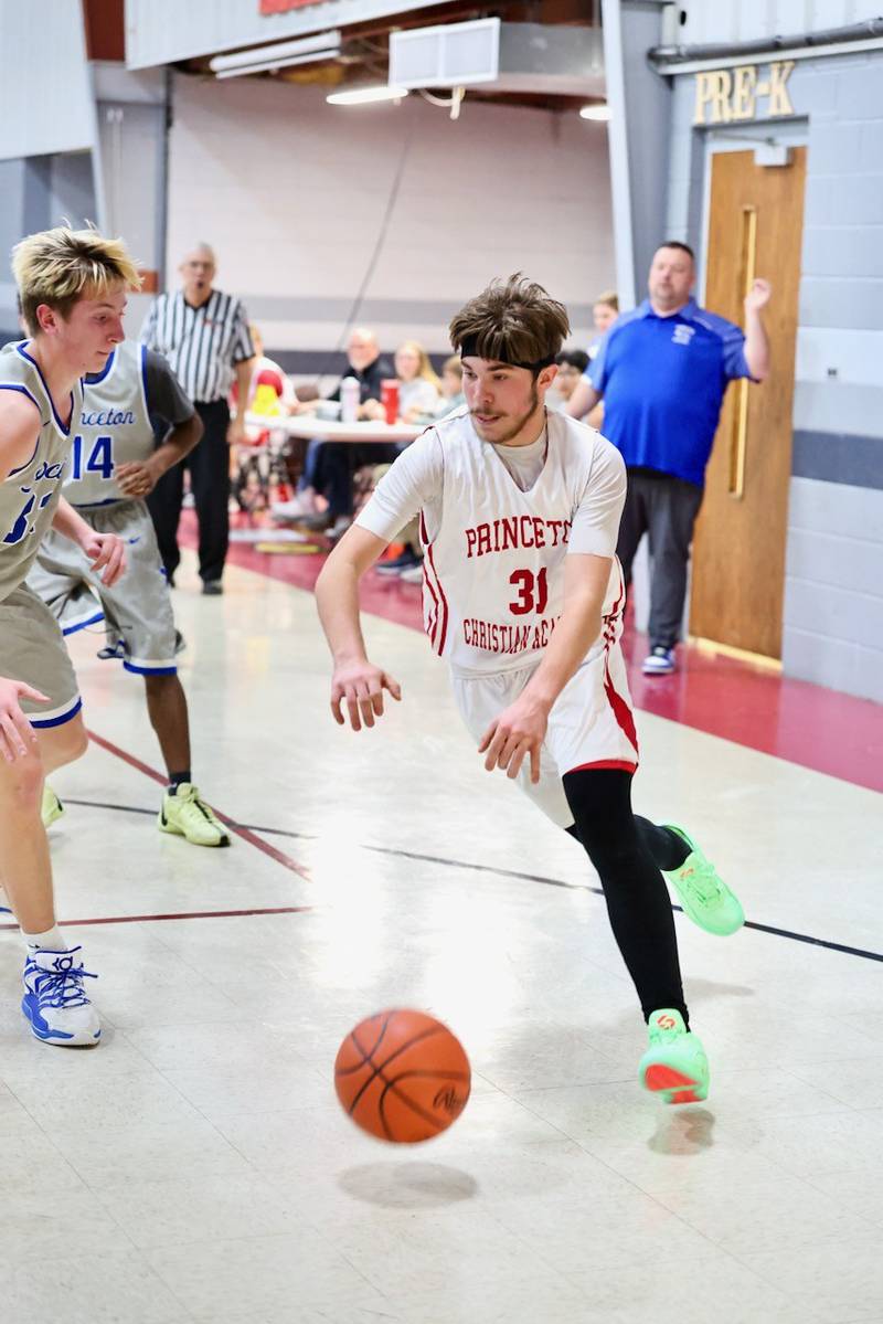 PCA's Jed Johns drives to the basket Thursday's JV game at Howard Hoffman Memorial Gymnasium.