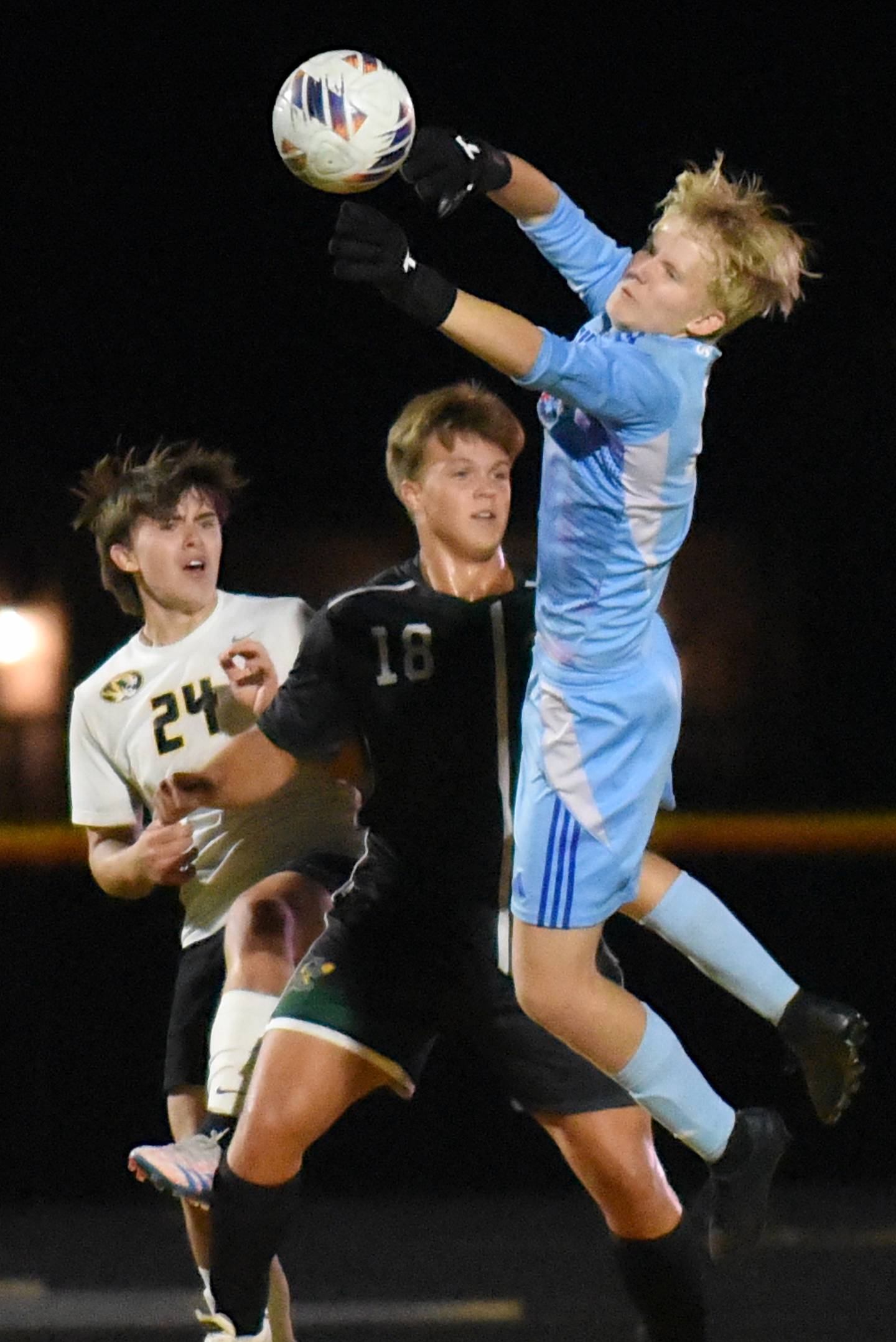 Herscher's Gabriel Kelly, right, makes a save in front of fellow Tiger Brock Berns, left, and Coal City's Julian Micetich during a game at Coal City Thursday, Oct. 2, 2025.