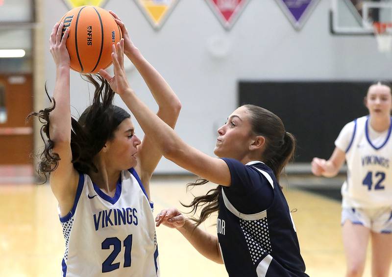 Geneva's Ella Wilkison is guarded by St. Viator's Gabriella Scaravalle during the IHSA Class 3A Woodstock North Supersectional girls basketball game on Monday, March 2, 2026, at Woodstock North High School.
