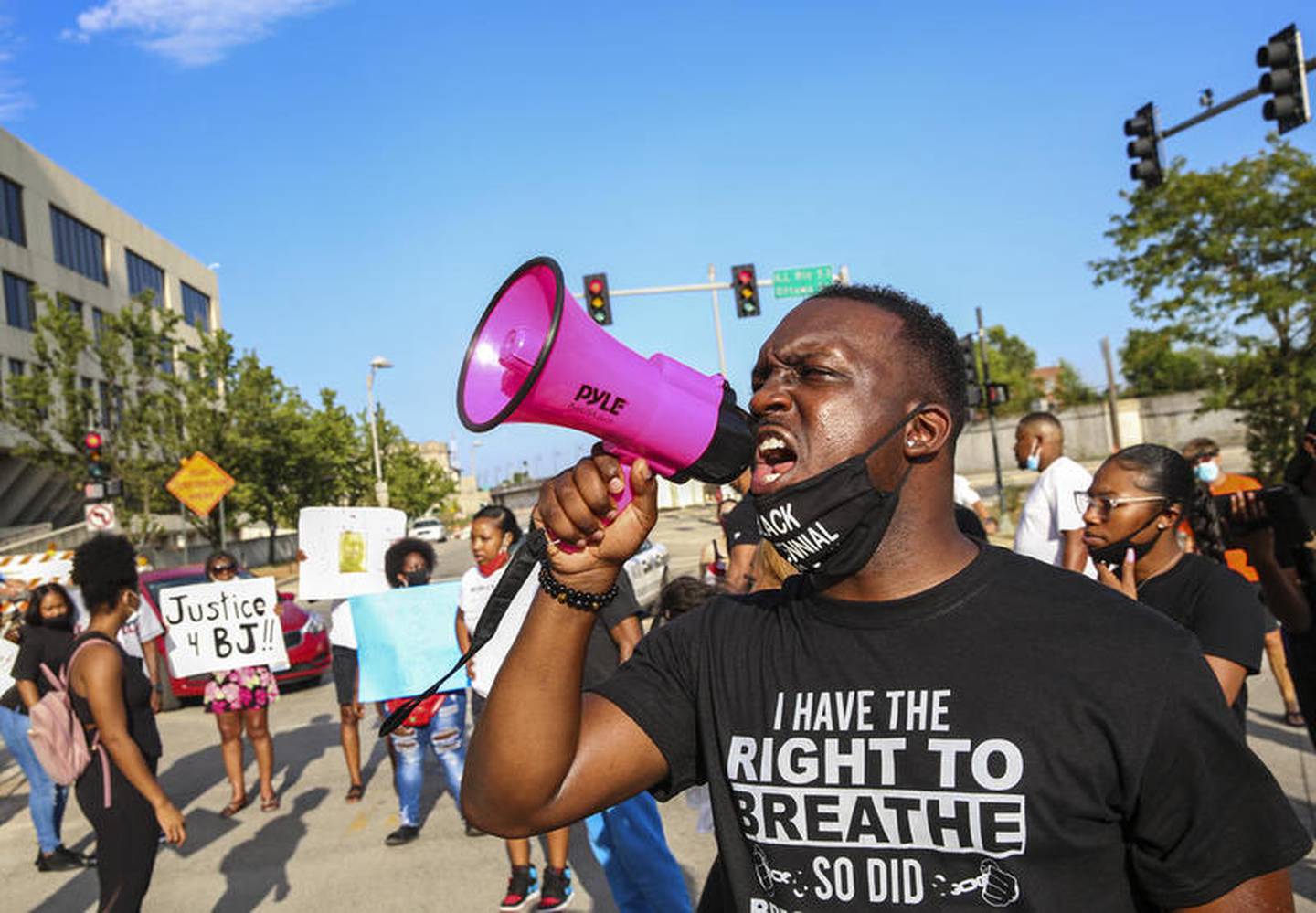 Demonstrators can be seen protesting outside Joliet City Hall, the Will County Courthouse and the Joliet Police Department on Saturday, Aug. 22, 2020, in response to the January 28 overdose death of Eric Lurry who died in police custody.