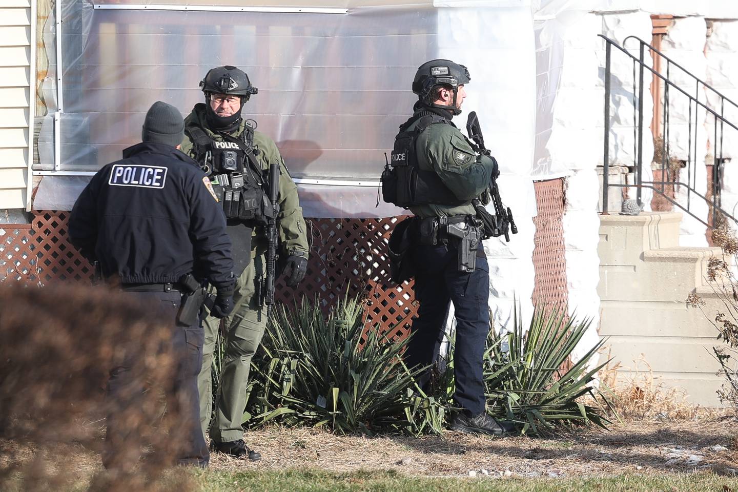 Joliet police stand at the corner of Youngs Avenue and Irving Street during a standoff on Thursday, Jan. 9, 2025 in Joliet.