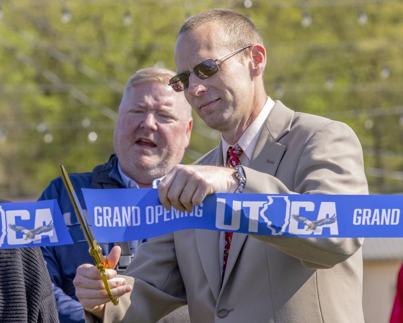Utica Mayor David Stewart cuts the ribbon for the grand opening of Market On Mill on May 3, 2025 in Utica, Illinois.