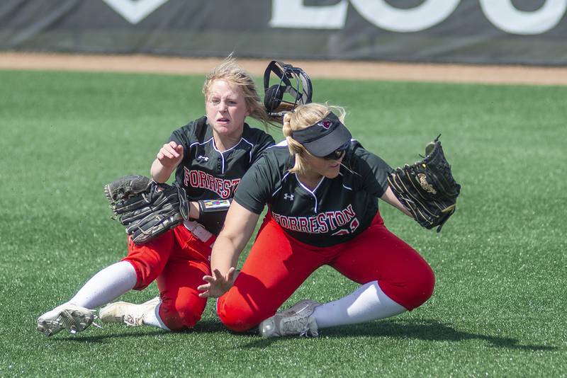Forreston’s Alaina Miller (left) and Aubrey Sanders collide on the final out of the game against Newark Saturday, June 4, 2022 during the IHSA Class 1A softball state third place game. The Forreston Cardinals took 3rd place at the state tourney. June 4 2022 during the IHSA Class 1A softball state third place game.