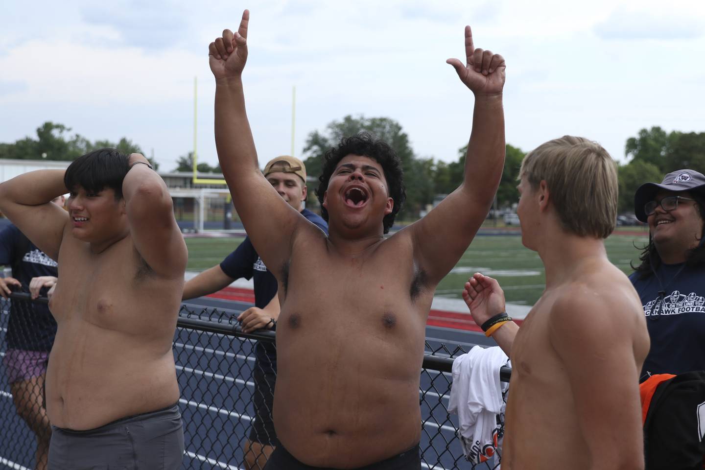 Oswego's Chris Villalbazo celebrates his first place win in the Watermelon eating race at the West Aurora "Battle of the Butts" Lineman Challenge, July 10, 2025  in Aurora.