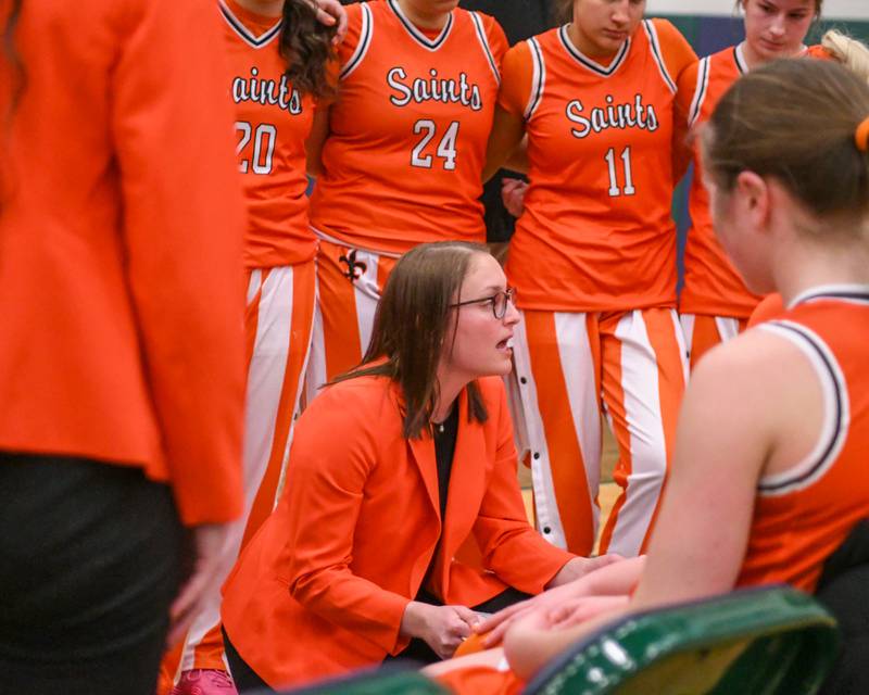 St. Charles East's head coach Katie Claussner talks to the team between quarters on Thursday Feb. 26, 2026, during the 4A Sectional championship game Glenbard West held at Bartlett High School.