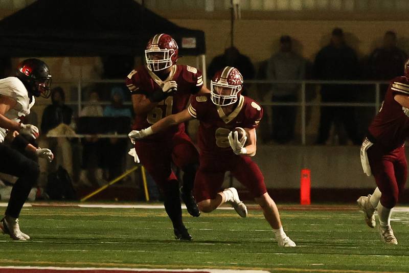 Morris’ Caeden Curran rushes against Highland on Saturday, Nov. 9, 2024 in Morris.