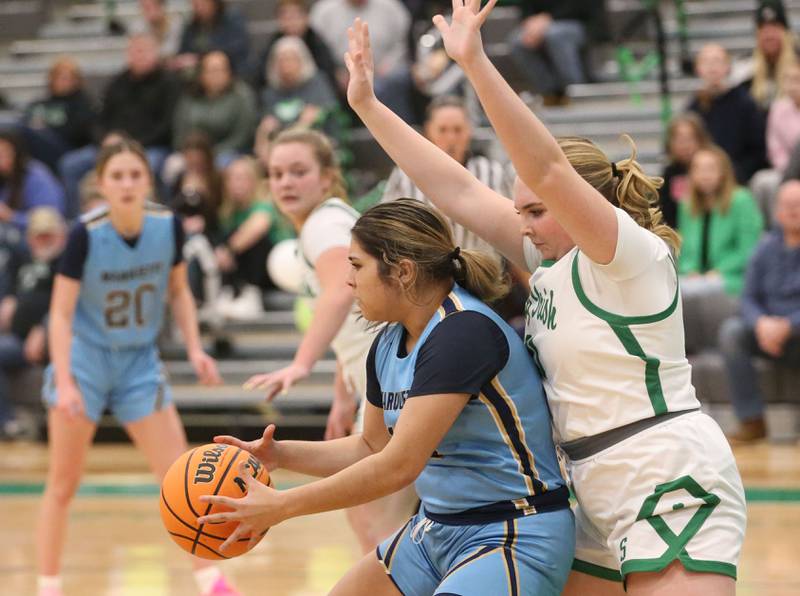 Marquette's Sonya Mitre catches a pass in the lane as Seneca's Camruyn Stecken guards on Thursday, Feb. 5, 2026 at Seneca High School.