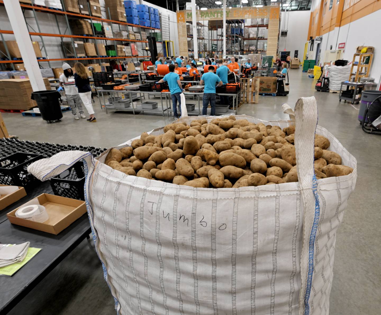 A “jumbo” sack of potatoes waits to be sorted and bagged at the Northern Illinois Food Bank in Geneva on Thursday, July 10, 2025.