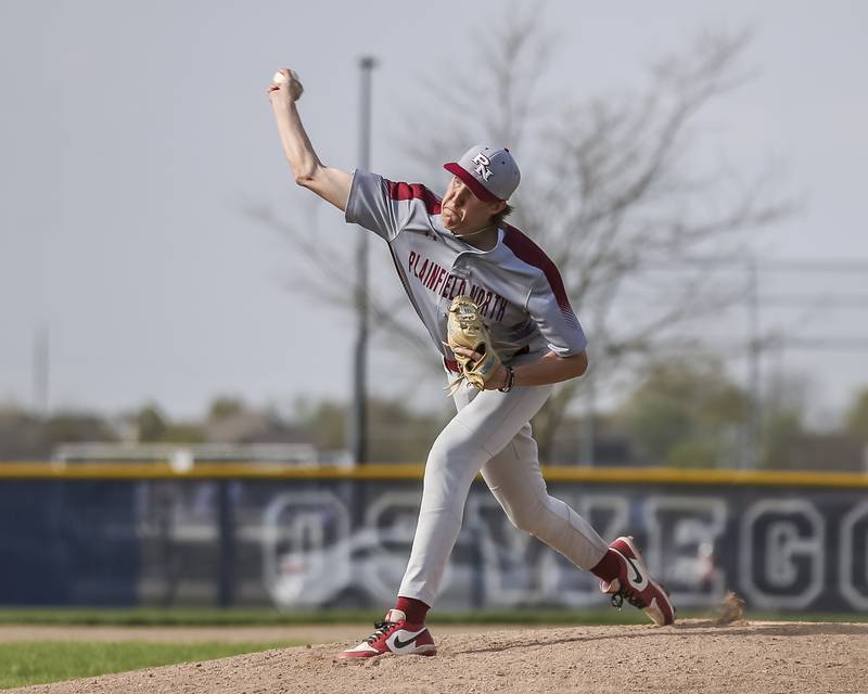Plainfield North's Will Burke (17) delivers a pitch during baseball game between Plainfield North at Oswego East, Monday, April 28, 2025 in Oswego.