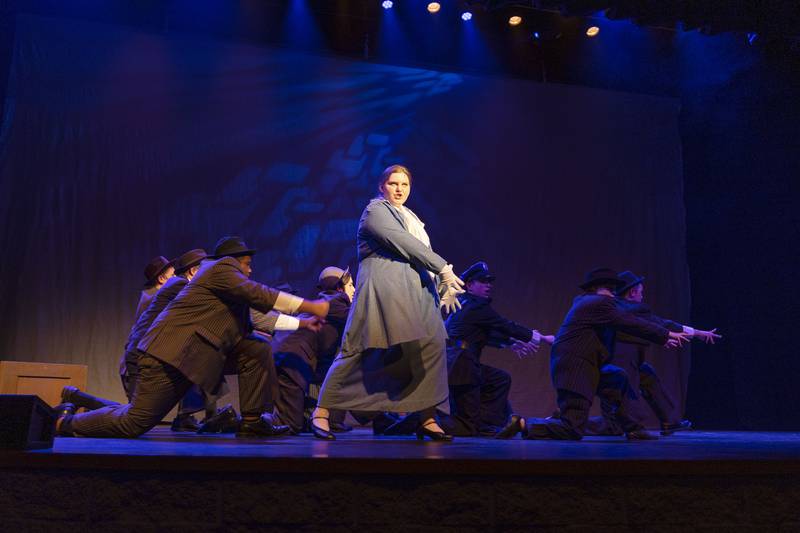 Anna Hutchinson, playing Duchess Estonia Dulworth, leads her vice squad in a song during rehearsal of Sterling High School’s “Nice Work…If You Can Get It,” Thursday, Feb. 23, 2023.