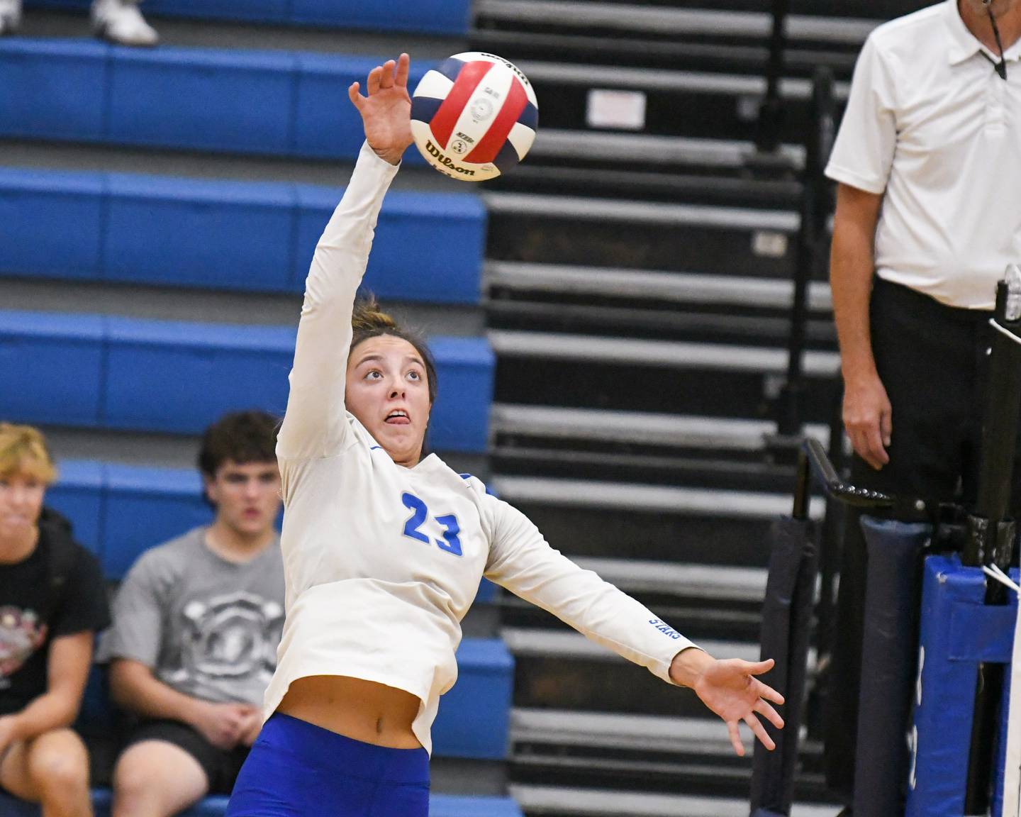 St. Charles North's Haley Burgdorf (23) spikes the ball during the game on Wednesday Oct. 2, 2024, while traveling to take on St. Francis High School in Wheaton.
