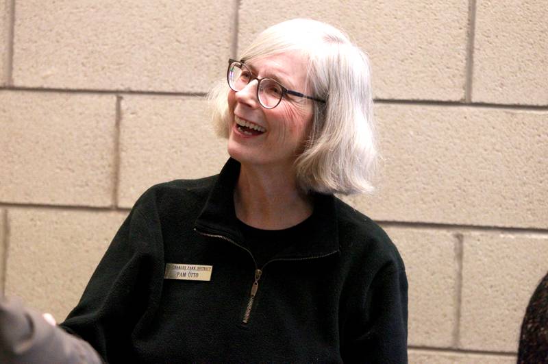 Pam Otto, a naturalist and outreach ambassador at the St. Charles Park District, greets friends and colleagues at a retirement party in her honor on Tuesday, Dec. 17, 2024 at the Hickory Knolls Discovery Center in St. Charles.