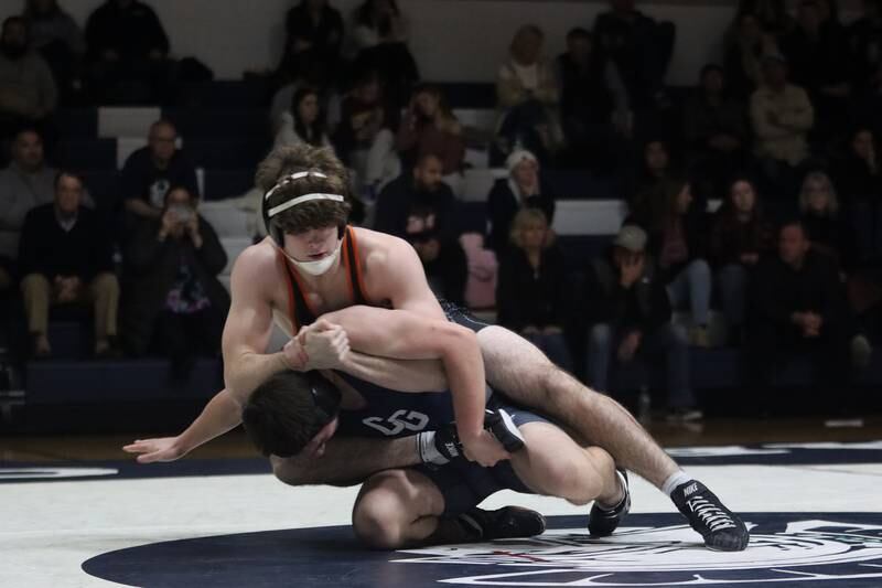 Crystal Lake Central’s Tyler Porter battles Cary-Grove’s Anthony Basso at 175 pounds in varsity wrestling Thursday, Dec. 19, 2024 at Cary-Grove High School in Cary.