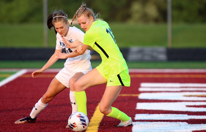 Richmond-Burton’s Margaret Slove, right, battles Willows’ Julia Lechner in Class 1A Sectional title soccer action at Richmond Friday night.