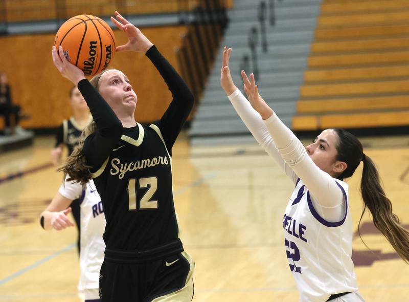 Sycamore's Sadie Lang shoots over Gianna Olguin Friday, Dec. 5, 2025, during their game at Rochelle High School.