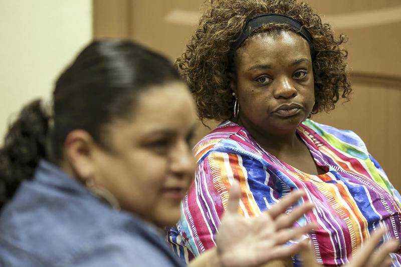 Leslie Jones, listens to Amy Sanchez speak about the lack of progress in the Sema'j Crosby case on Thursday, June 22, 2017, at the Joliet Unity Community Development Co., in Joliet, Ill.