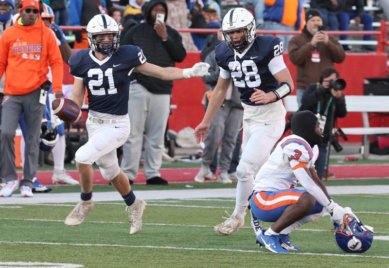 Cary-Grove's Patrick Weaver celebrates his game clinching interception of an East St. Louis pass Saturday, Nov. 25, 2023, during the IHSA Class 6A state championship game in Hancock Stadium at Illinois State University in Normal.