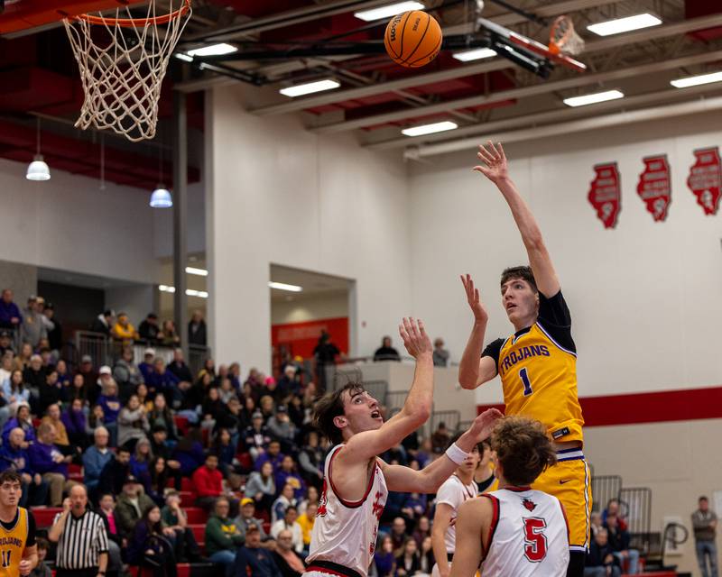 Cole Tillman (1) of Mendota shoot ball over Braden Curran (33) and teammate Jabob Andracke (5) of Hall in the championship game of the Colmone Classic on Saturday, December 20, 2025 at Hall High School in Spring Valley.