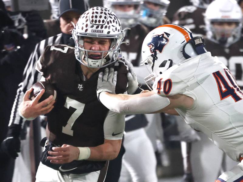 Mount Carmel's Emmett Dowling is pushed out of bounds by Oswego's Conor Tully Wednesday, Dec. 3, 2025, during their IHSA Class 8A state chamionship game in Huskie Stadium at Northern Illinois University in DeKalb.