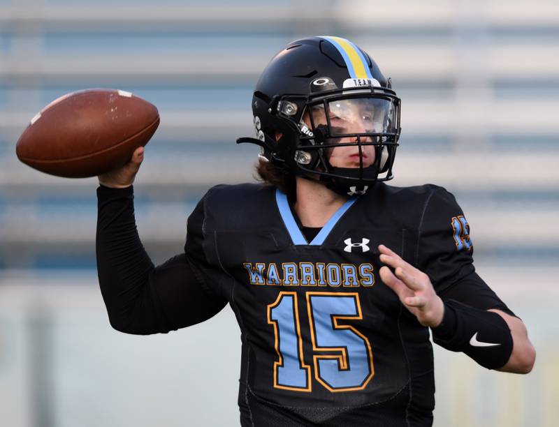 Joe Lewnard/jlewnard@dailyherald.com
Maine West quarterback Thomas Delaney throws a pass during Friday’s game against Schaumburg.