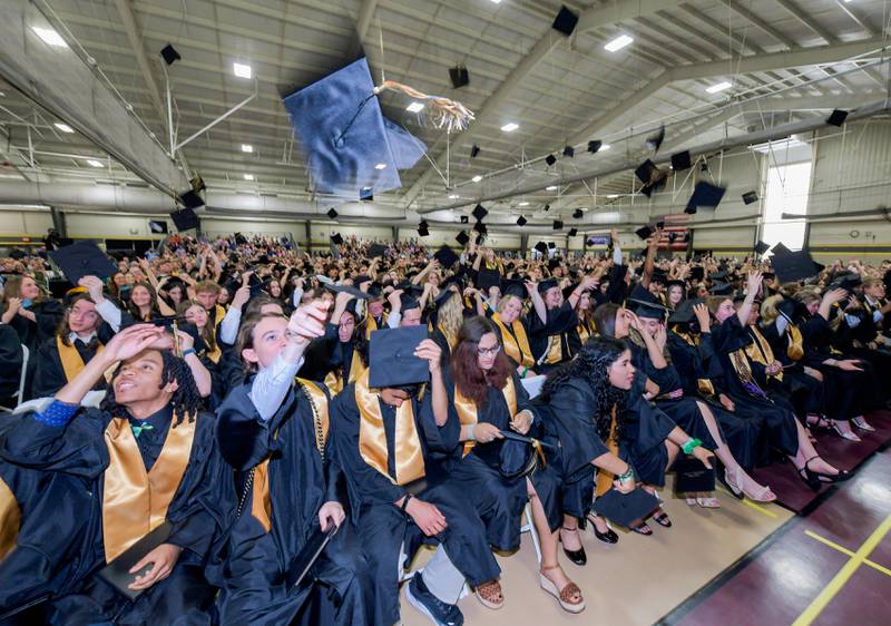 2024 Sycamore High School graduates toss their caps in the air at the conclusion of the commencement in Sycamore on Sunday, May 26, 2024.